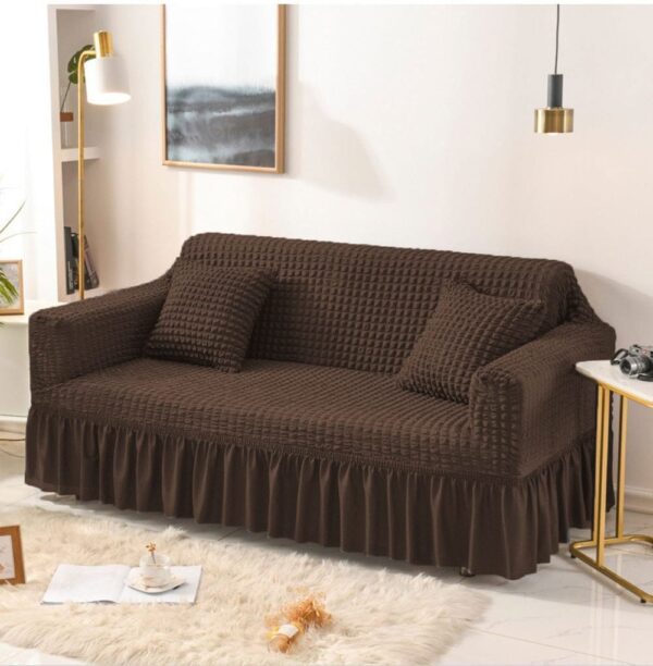 Dark brown Persian style sofa cover with fitted frilled design and stretchable fabric
