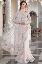 Maria B Peach Color Saree Collection 2025 available at sarastore.pk featuring heavily embroidered net, silk peticoat, and cut-work borders