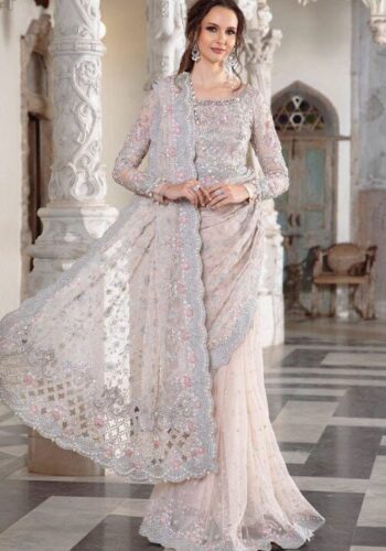 Maria B Peach Color Saree Collection 2025 available at sarastore.pk featuring heavily embroidered net, silk peticoat, and cut-work borders