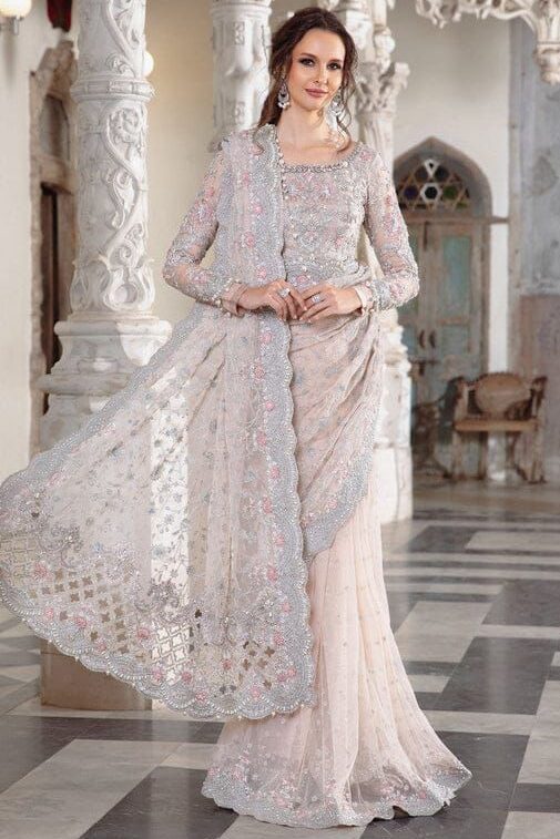 Maria B Peach Color Saree Collection 2025 available at sarastore.pk featuring heavily embroidered net, silk peticoat, and cut-work borders