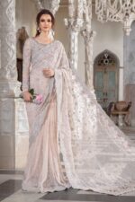 Maria B Peach Color Saree Collection 2025 available at sarastore.pk featuring heavily embroidered net, silk peticoat, and cut-work borders