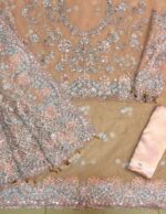 Maria B Peach Color Saree Collection 2025 available at sarastore.pk featuring heavily embroidered net, silk peticoat, and cut-work borders